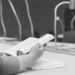 Person reading a book sat at a table