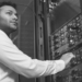 A person standing in front of a computer