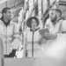 A group of people looking at a tablet