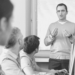 A person talking to a group of people